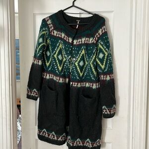 Free people sweater size small. Small hole in one sleeve. See photo